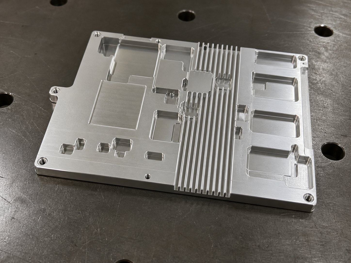 Prototype Machining of a Plate Heat Sink: Hole-Slot Relationships, Datums and Burr Control