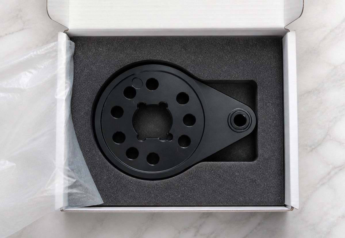 Protected foam packaging for black anodized humanoid robot ankle swing arm