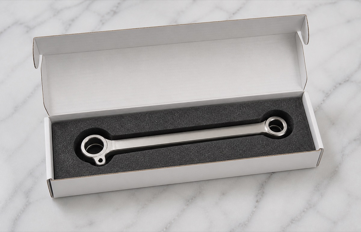 Form-fit foam packaging for a polished TC4 titanium long ankle link