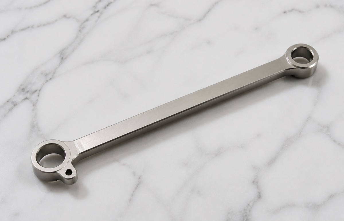 Polished TC4 titanium long ankle link for a humanoid robot joint