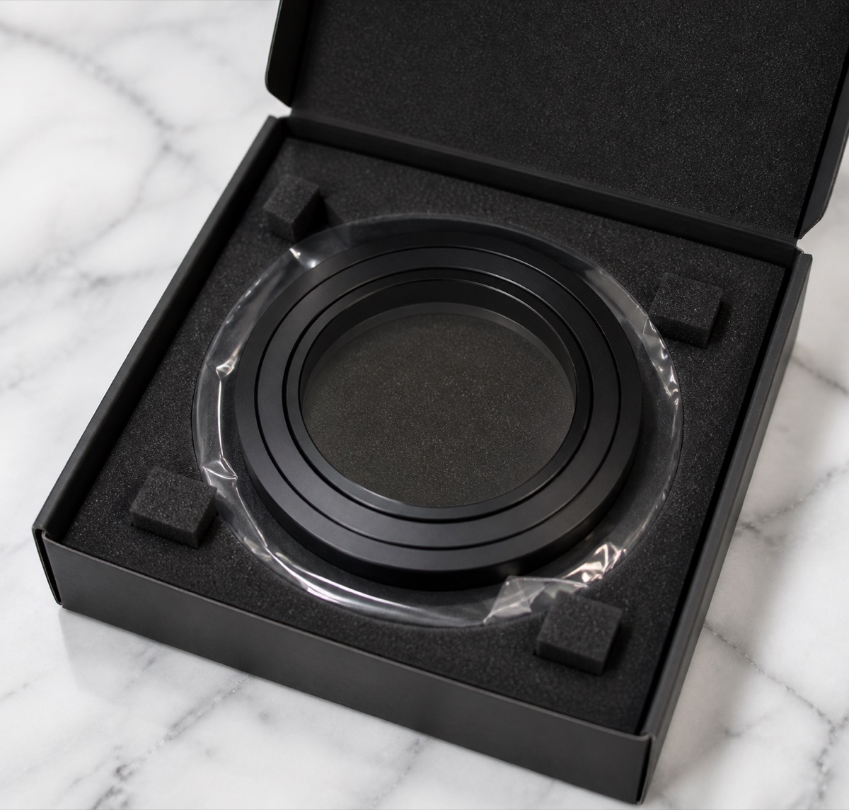 Separated protective packaging for a black anodized humanoid robot joint spacer washer