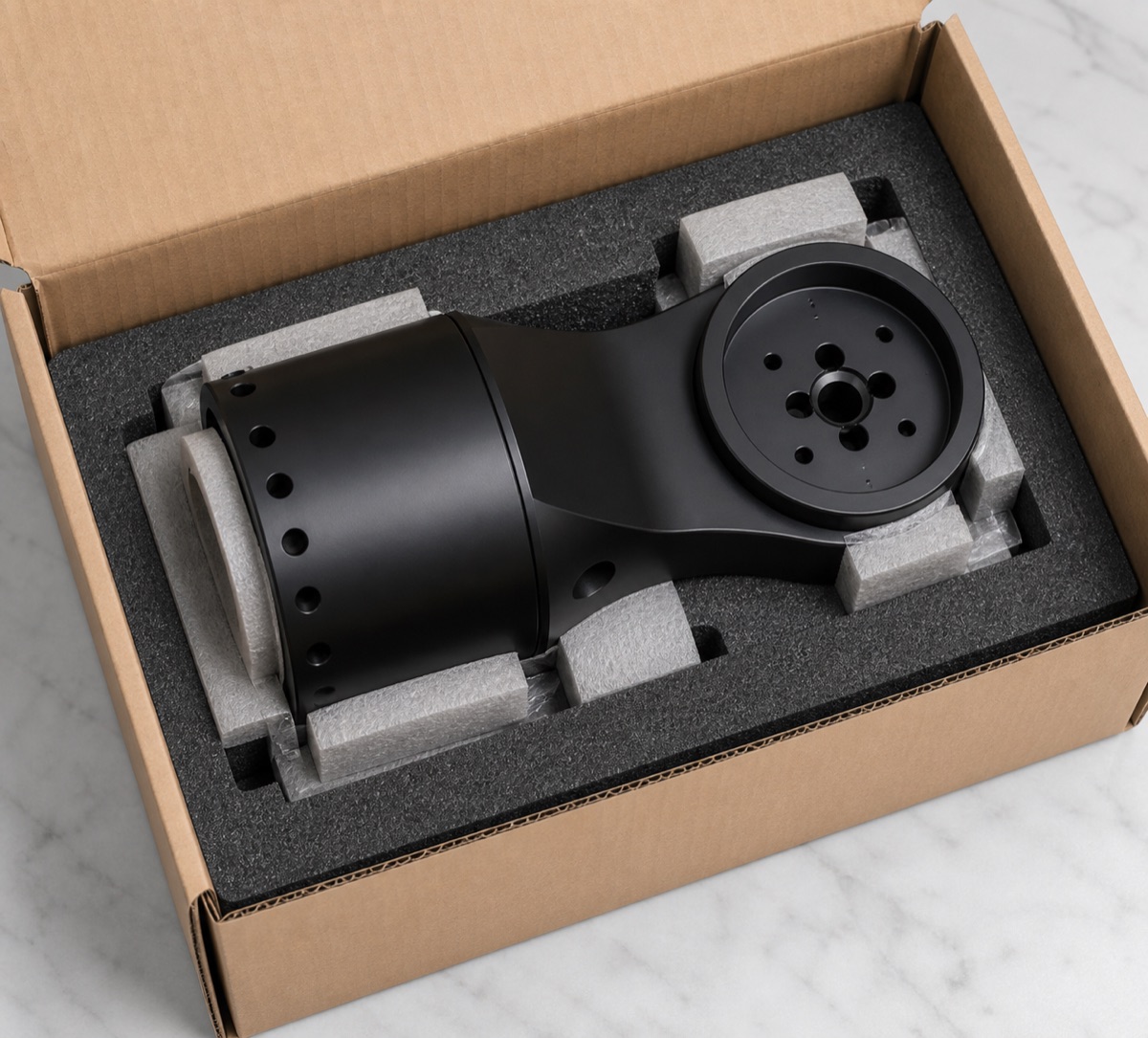 Form-fit foam packaging for a black anodized robot five-axis module seat