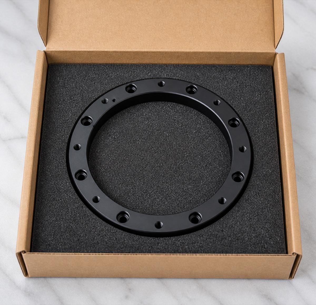 Single-part foam packaging for a black anodized robot first-axis fixed ring