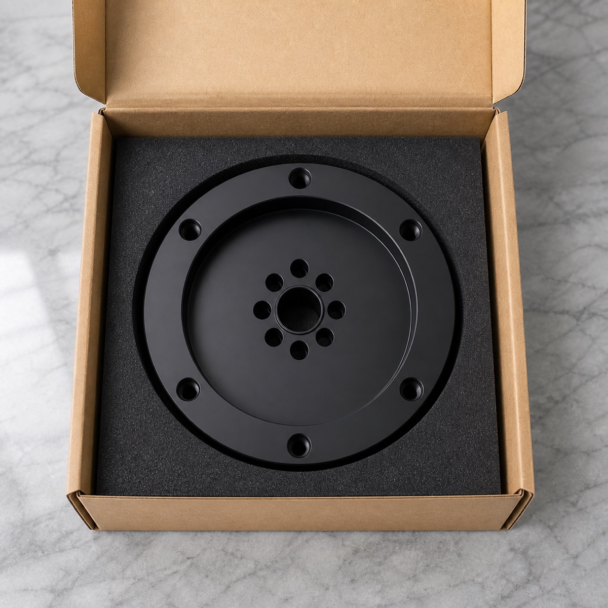 Single-part foam packaging for a black anodized robot third-axis connection flange